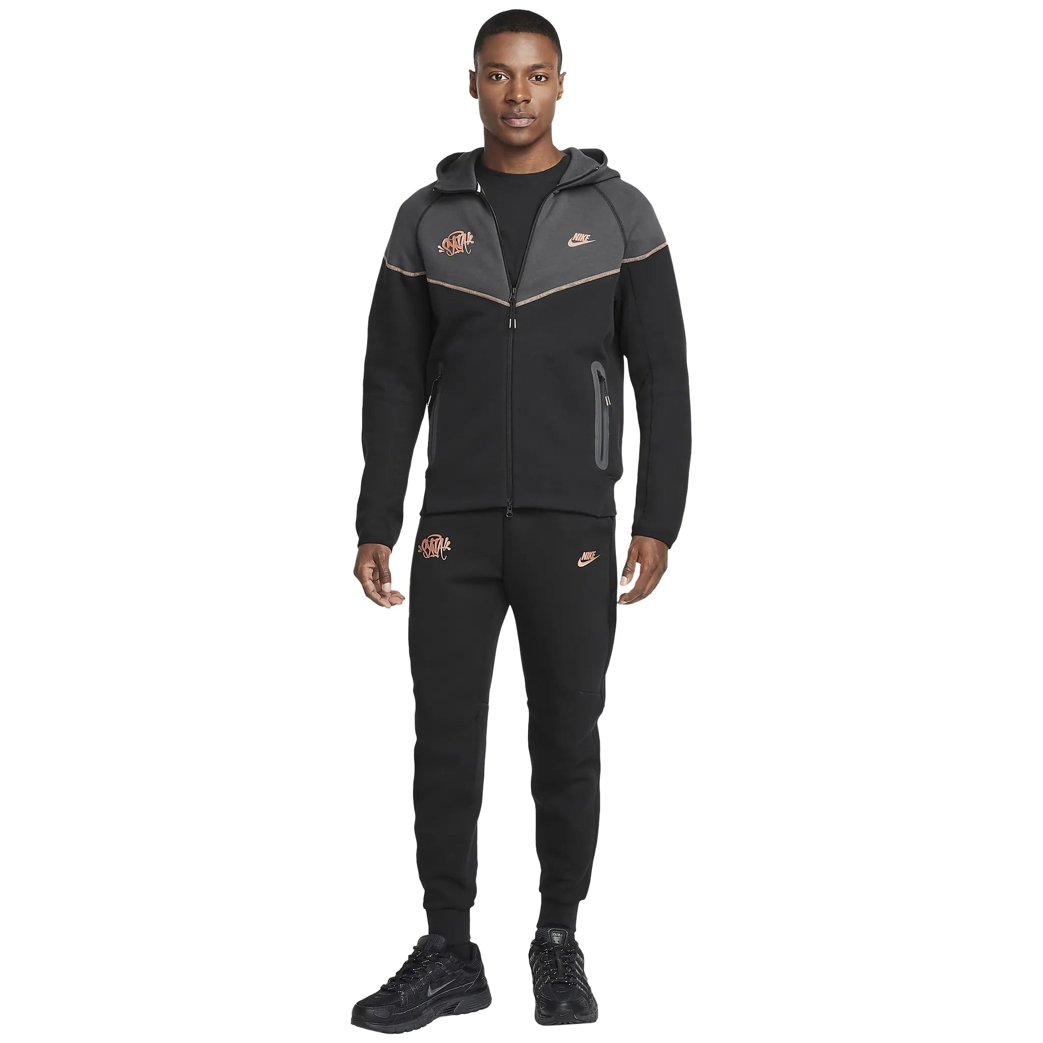 Model full view of Syna World x Nike Central Cee Tech Fleece Black Tracksuit HQ3748-010 | HQ3749-010